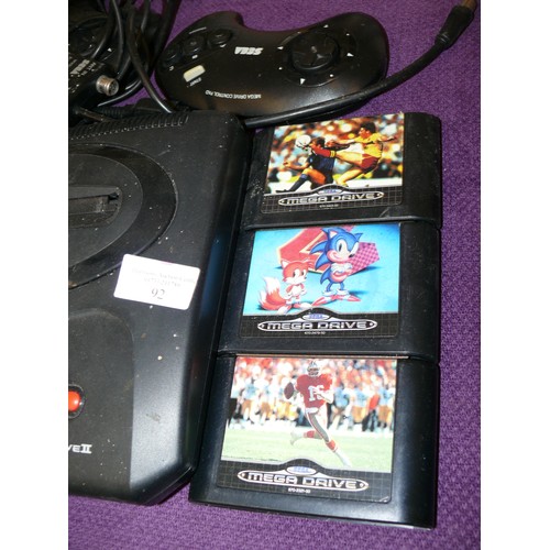 92 - A SEGA MEGA DRIVE 16BIT WITH CONTROLLERS AND VARIOUS GAMES TO INCLUDE STREET RACER AND SONIC PLUS A ... 