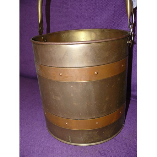 99 - A LARGE BRASS BUCKET WITH COPPER BANDING