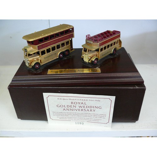 87 - 2 DIECAST LLEDO GOLD COLOURED ROYAL WEDDING ANNIVERSARY BUSES ON PLINTH