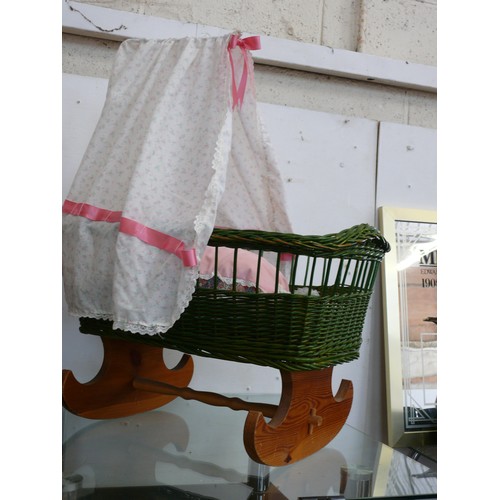 126 - A NICE WICKER DOLLS CRIB WITH ROCKING WOODEN BASE AND CANOPY