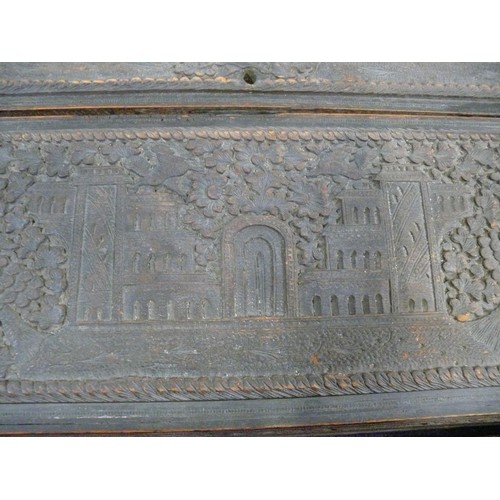 102A - A VINTAGE HEAVILY CARVED ORIENTAL WOODEN WRITING BOX WITH FITTED INTERIOR