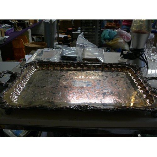 214 - A VINTAGE HEAVILY DECORATED SILVER PLATE TRAY