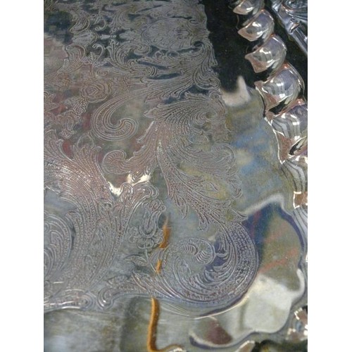 214 - A VINTAGE HEAVILY DECORATED SILVER PLATE TRAY