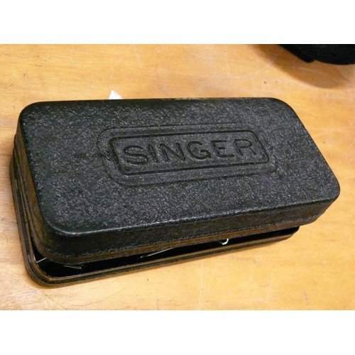 242 - A VINTAGE SINGER SEWING MACHINE CASE OF PARTS POSSIBLY A BUTTON THREADER