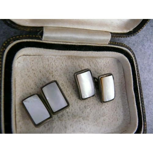 28 - A PAIR OF SILVER CUFF LINKS WITH MOTHER O PEARL ON BOTH SHOWING SIDES