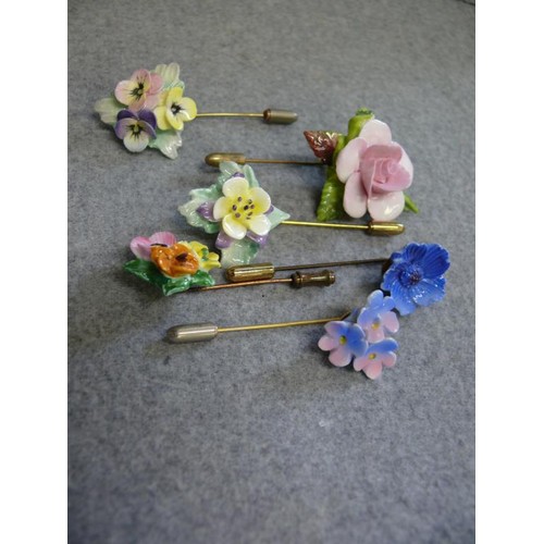 35 - A SET OF SIX PORCELAIN HAND MADE AND PAINTED COLLAR STICK PINS