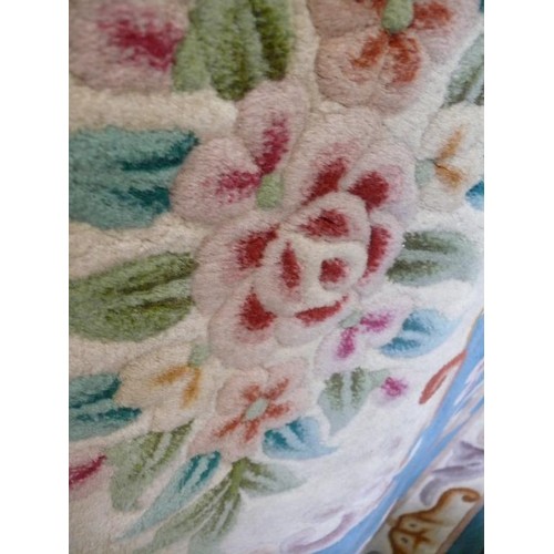 377 - A LARGE GOOD QUALITY GREEN FLORAL RUG