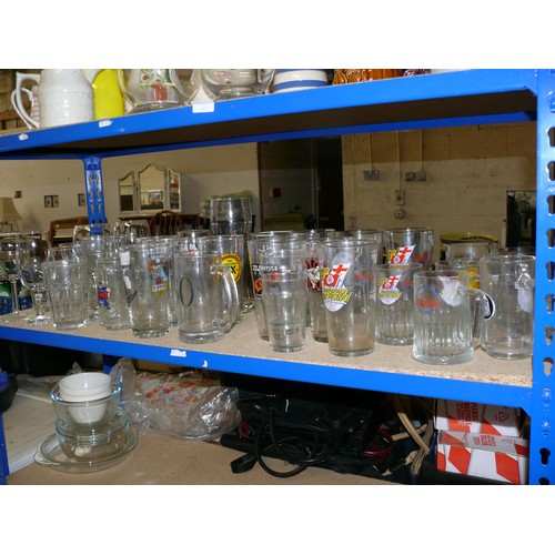 449 - SHELF OF GLASSES MAINLY ADVERTISING PINT GLASSES