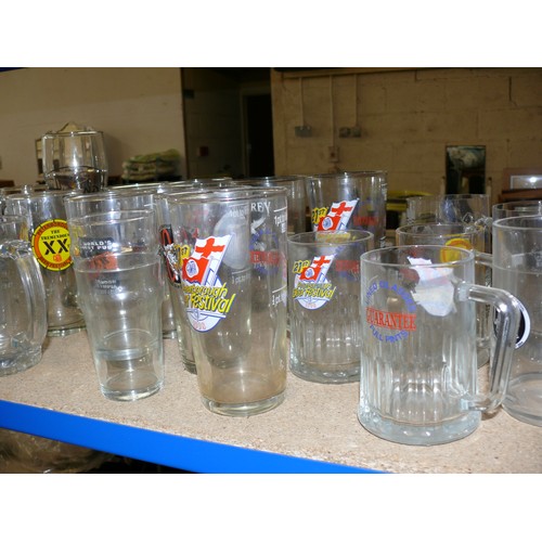 449 - SHELF OF GLASSES MAINLY ADVERTISING PINT GLASSES