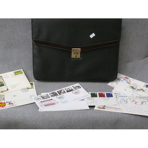 114 - A SELECTION OF 10 FIRST DAY COVERS AND A LEATHER BRIEFCASE