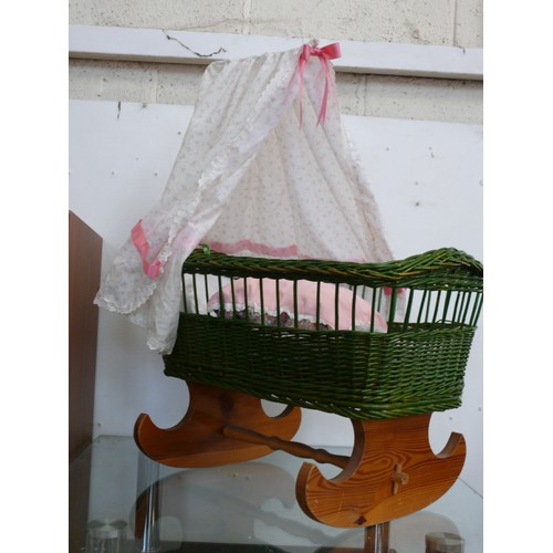 126 - A NICE WICKER DOLLS CRIB WITH ROCKING WOODEN BASE AND CANOPY