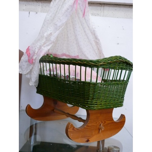 126 - A NICE WICKER DOLLS CRIB WITH ROCKING WOODEN BASE AND CANOPY