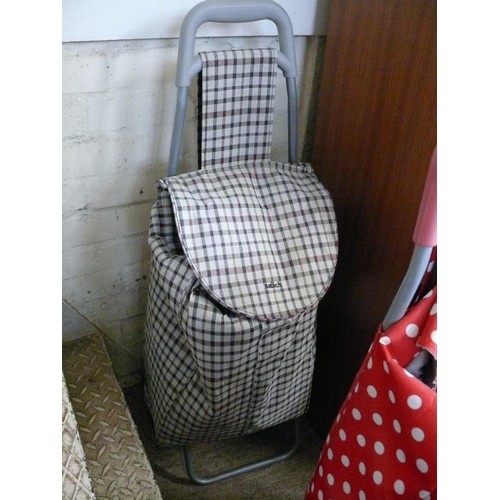 144B - 2 GOOD QUALITY SHOPPING TROLLEYS 1 RED POLKA DOT AND 1 BROWN CHECK