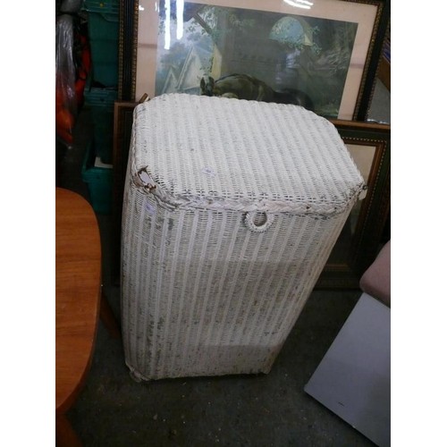 356 - A WOODEN STORAGE STOOL WITH PINK UPHOLSTERED SEAT TOP AND A WICKER LAUNDRY BASKET