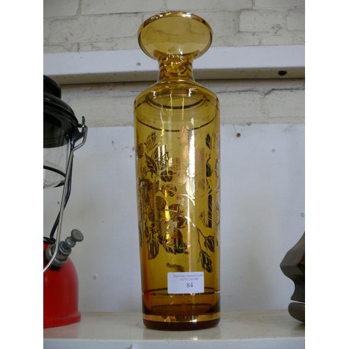 84 - A LOVELY VINTAGE AMBER GLASS VASE WITH FLORAL GILT DECORATION