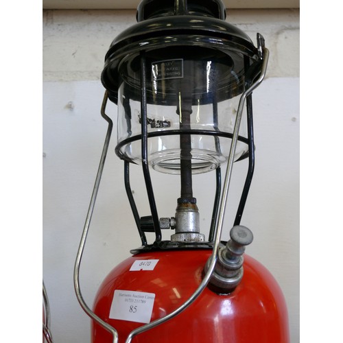 85 - A VINTAGE TILLEY LAMP WITH RED BASE