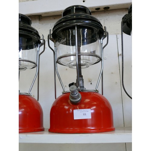 88 - A VINTAGE TILLEY LAMP WITH RED BASE