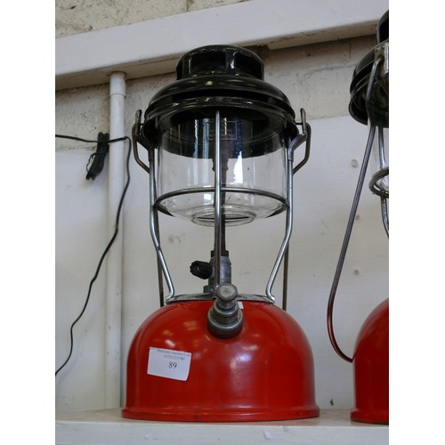 89 - A VINTAGE TILLEY LAMP WITH RED BASE