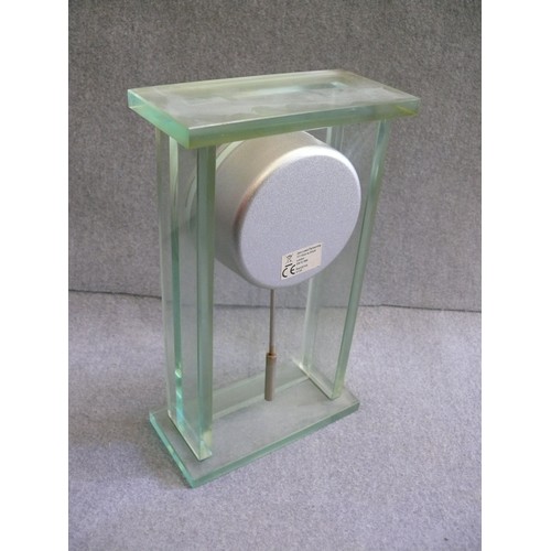 102 - A VERY HEAVY GREEN GLASS MANTLE CLOCK BY GREENWICH, LONDON