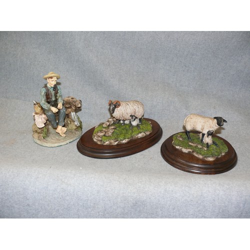 98 - A PAIR OF COUNTRY ARTISTS SHEEP FIGURINES PLUS A FISHERMAN WITH A DOG