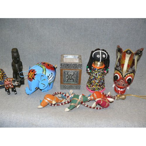 127 - A COLLECTION OF DECORATIVE ITEMS TO INCLUDE METAL ELEPHANT, EGYPTIAN HEAD, WOODEN TRIBAL ITEMS ETC