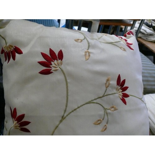 230 - A PAIR OF CREAM CURTAINS WITH RED FLOWERS PLUS A FURTHER PAIR OF PLAIN CREAM CURTAINS