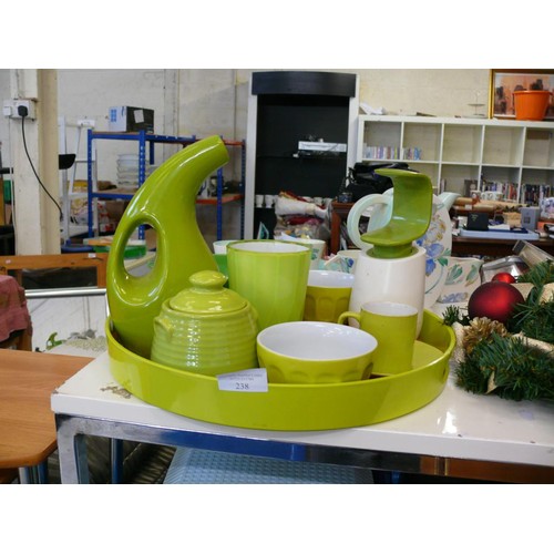 238 - A GREEN RETRO TRAY WITH CONTENTS OF GREEN KITCHENWARE AND DECORATIVE ITEMS