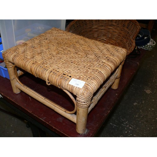 246 - A SMALL WOVEN WICKER FOOTSTOOL