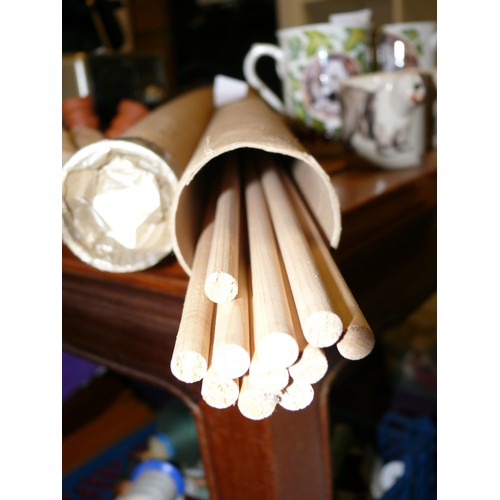 188 - 2 TUBES OF LONG WOODEN DOWELS