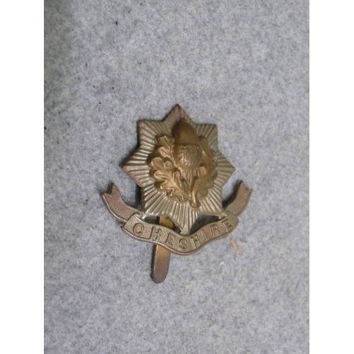 56 - CHESHIRE REGIMENT  WITH SCROLL ARMY CAP BADGE