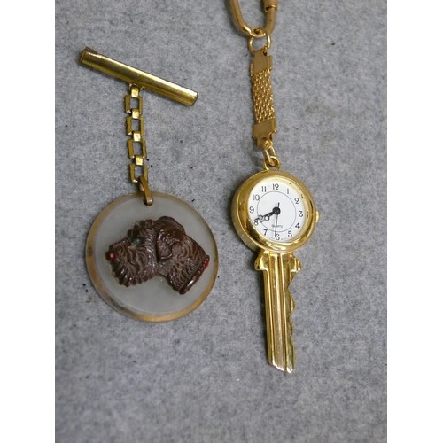 58 - WATCH KEY AND BROOCH WITH TERRIER DESIGN