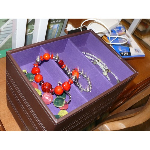 329 - A SET OF STACKERS JEWELLERY BOXES WITH A SMALL AMOUNT OF JEWELLERY