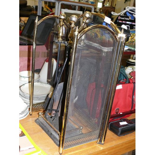 343 - A LARGE BRASS AND CAST IRON COMPANION SET AND A FIRE SCREEN