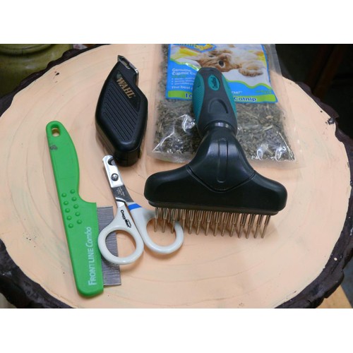 348 - A CAT CARE LOT TO INCLUDE WAHL CLIPPERS, COMBS, SCISSORS AND CATNIP