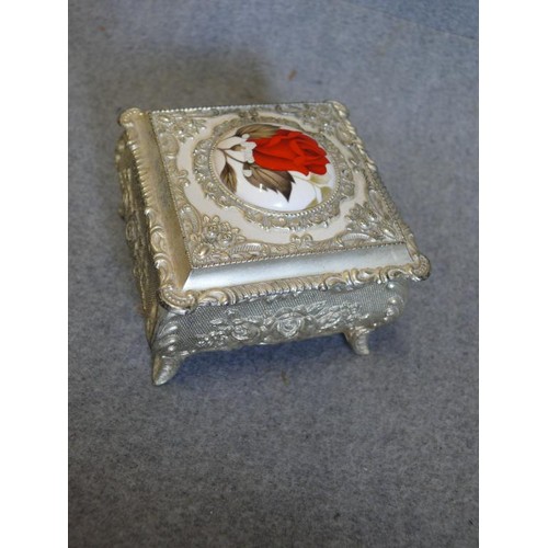 25 - SILVERPLATE ORNATE  TRINKET BOX ON FEET WITH CENTRAL ENAMEL ROSE FEATURE