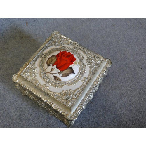 25 - SILVERPLATE ORNATE  TRINKET BOX ON FEET WITH CENTRAL ENAMEL ROSE FEATURE