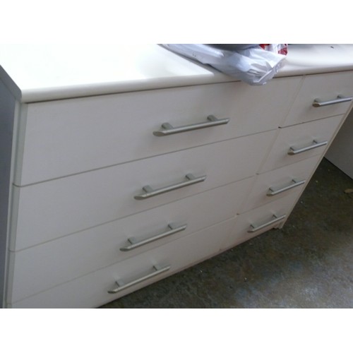 291 - A LARGE WHITE 8 DRAWER CHEST OF DRAWERS