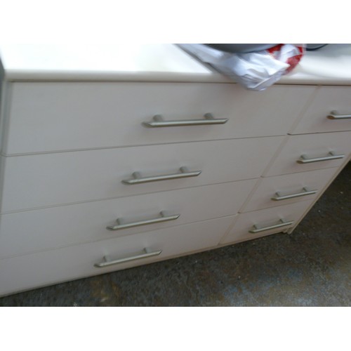 291 - A LARGE WHITE 8 DRAWER CHEST OF DRAWERS