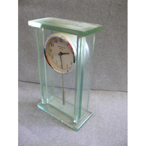 102 - A VERY HEAVY GREEN GLASS MANTLE CLOCK BY GREENWICH, LONDON