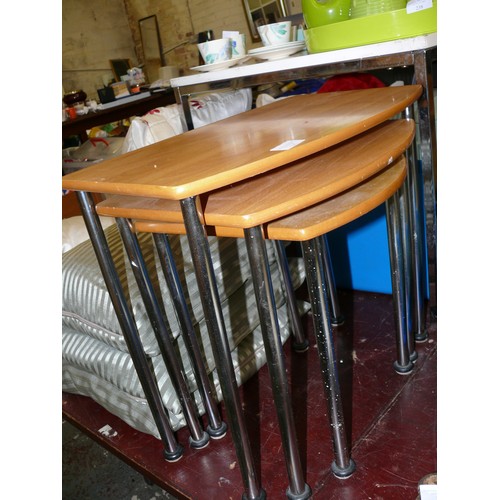 235 - A NEST OF 3 TABLES WITH METAL LEGS