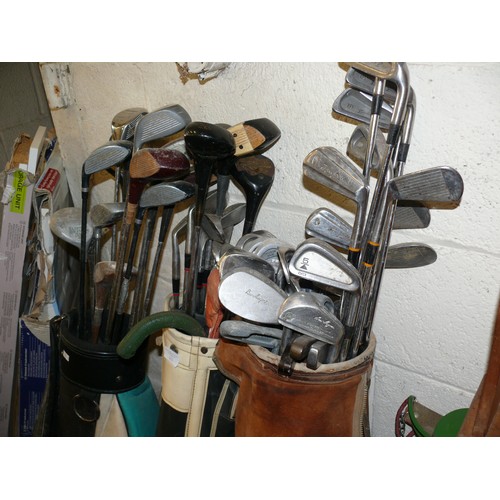 255 - 3 BAGS FULL OF VINTAGE GOLF CLUBS AND A SET OF CADDY WHEELS