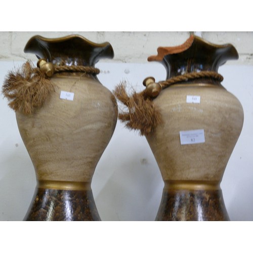 82 - A PAIR OF VERY LARGE TERRACOTTA URN STYLE VASES ONE WITH DAMAGE TO TOP