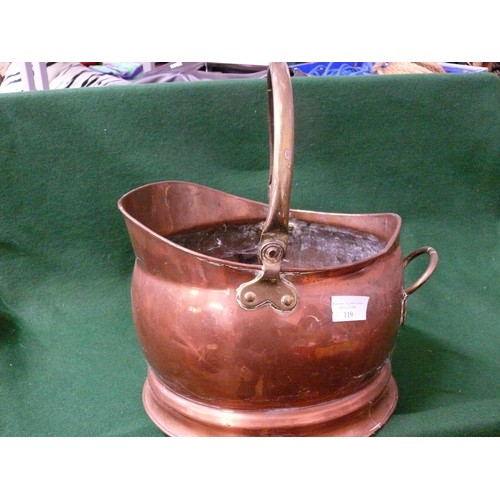 119 - A LARGE COPPER HELMET COAL SCUTTLE WITH BRASS HANDLE