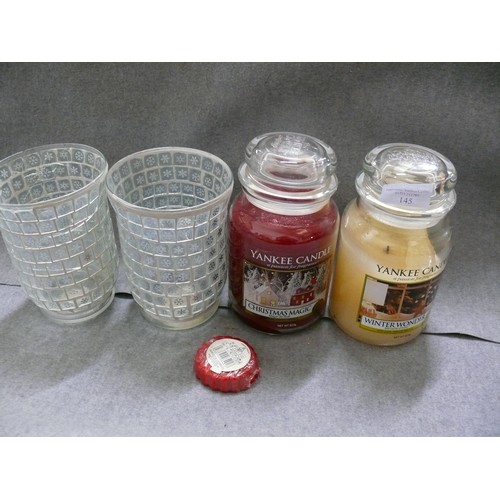 145 - 2 LARGE YANKEE CANDLES PLUS A SMALLER ONE PLUS A PAIR OF GLASS CANDLE HOLDERS