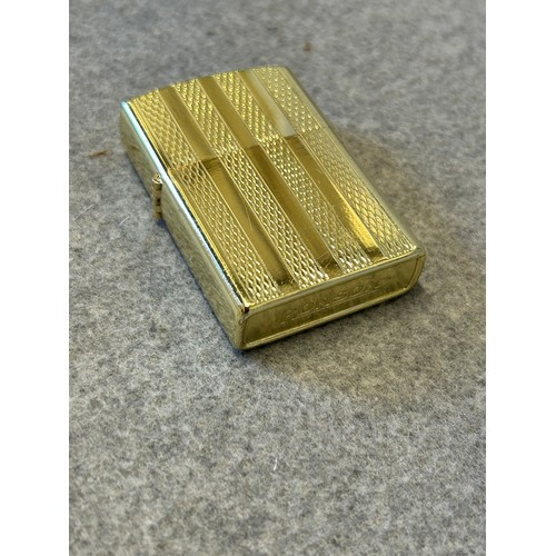 17 - A RONSON GOLD METAL LIGHTER IN THE STYLE OF ZIPPO