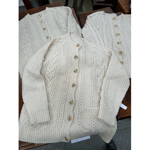 450 - 3 LOVELY HAND KNITTED ARAN WOOL CARDIGANS WITH HORN BUTTONS. SIZE MEDIUM