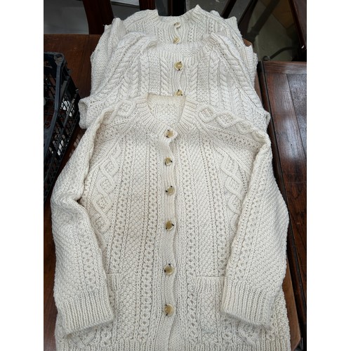 450 - 3 LOVELY HAND KNITTED ARAN WOOL CARDIGANS WITH HORN BUTTONS. SIZE MEDIUM