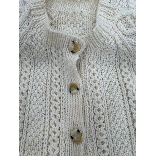 450 - 3 LOVELY HAND KNITTED ARAN WOOL CARDIGANS WITH HORN BUTTONS. SIZE MEDIUM