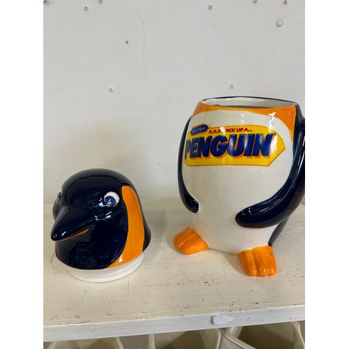 84 - A LARGE CERAMIC 'PENGUIN' BISCUIT BARREL IN THE SHAPE OF A PENGUIN