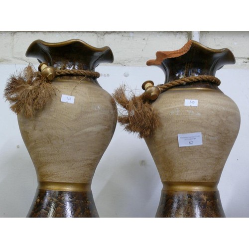 82 - A PAIR OF VERY LARGE TERRACOTTA URN STYLE VASES ONE WITH DAMAGE TO TOP